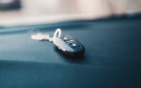 Close-up of a car key resting on a dashboard